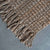 Natural jute rug with fringe